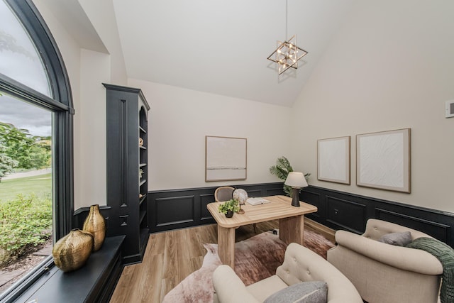 9117 Cambridge Dr, Saline, MI 48176 - home office with high vaulted ceiling, a chandelier, light wood-type flooring, and wainscoting