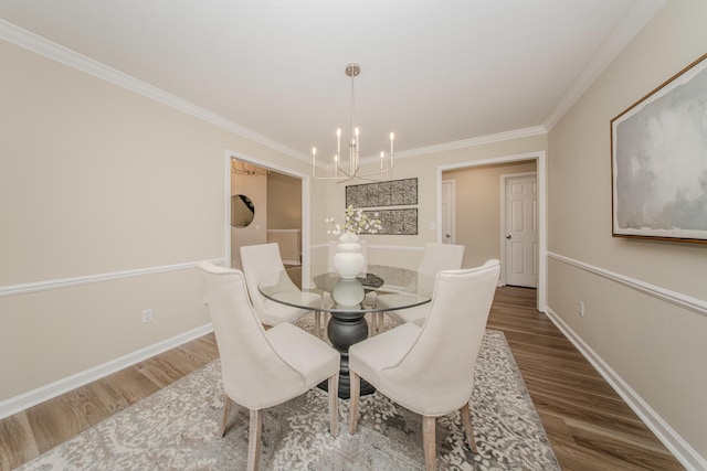 9117 Cambridge Dr, Saline, MI 48176 - dining space featuring a chandelier, wood finished floors, ornamental molding, and baseboards