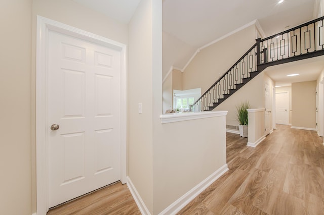 9117 Cambridge Dr, Saline, MI 48176 - entrance foyer featuring light wood-style floors, stairs, and baseboards