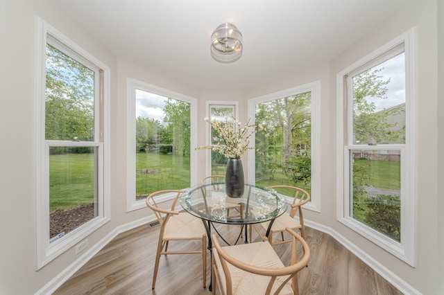 9117 Cambridge Dr, Saline, MI 48176 - sunroom with wood finished floors and baseboards