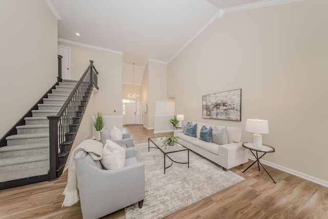 9117 Cambridge Dr, Saline, MI 48176 - living room featuring a chandelier, baseboards, stairway, ornamental molding, and wood finished floors