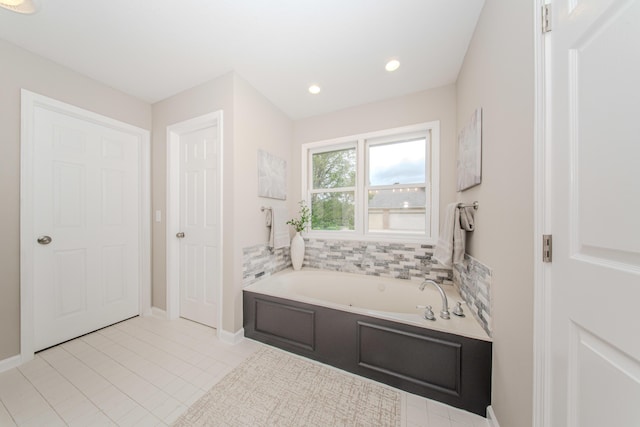 9117 Cambridge Dr, Saline, MI 48176 - bathroom with a bath, baseboards, tile patterned flooring, and recessed lighting