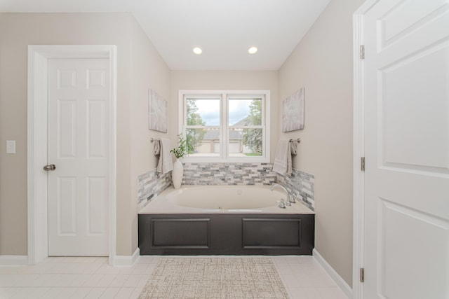 9117 Cambridge Dr, Saline, MI 48176 - bathroom with a garden tub, tile patterned floors, recessed lighting, and baseboards
