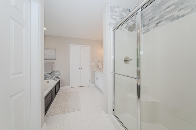 9117 Cambridge Dr, Saline, MI 48176 - full bath featuring a stall shower, vanity, tile patterned floors, and baseboards