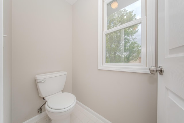 9117 Cambridge Dr, Saline, MI 48176 - bathroom featuring baseboards, toilet, and tile patterned flooring