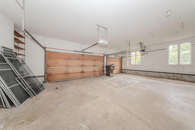 9117 Cambridge Dr, Saline, MI 48176 - garage featuring a garage door opener