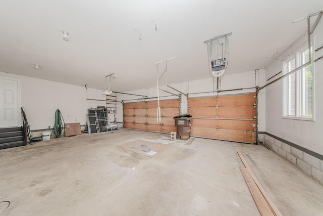 9117 Cambridge Dr, Saline, MI 48176 - garage featuring a garage door opener
