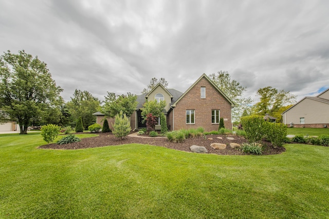 9117 Cambridge Dr, Saline, MI 48176 - view of front facade featuring brick siding and a front yard