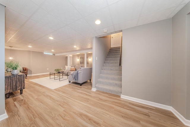 9117 Cambridge Dr, Saline, MI 48176 - living room featuring baseboards, stairway, light wood-type flooring, and recessed lighting
