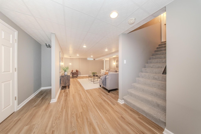 9117 Cambridge Dr, Saline, MI 48176 - stairway featuring wood finished floors, recessed lighting, and baseboards
