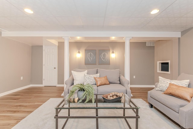 9117 Cambridge Dr, Saline, MI 48176 - living area with baseboards, wood finished floors, recessed lighting, and decorative columns