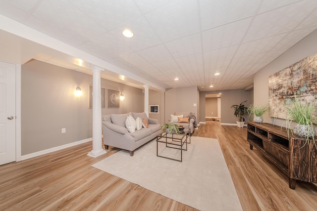 9117 Cambridge Dr, Saline, MI 48176 - living area featuring light wood-style flooring, baseboards, ornate columns, and recessed lighting