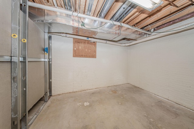 9117 Cambridge Dr, Saline, MI 48176 - unfinished below grade area with brick wall