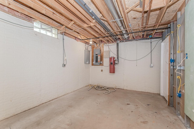 9117 Cambridge Dr, Saline, MI 48176 - below grade area with brick wall, a central vacuum unit, and electric panel