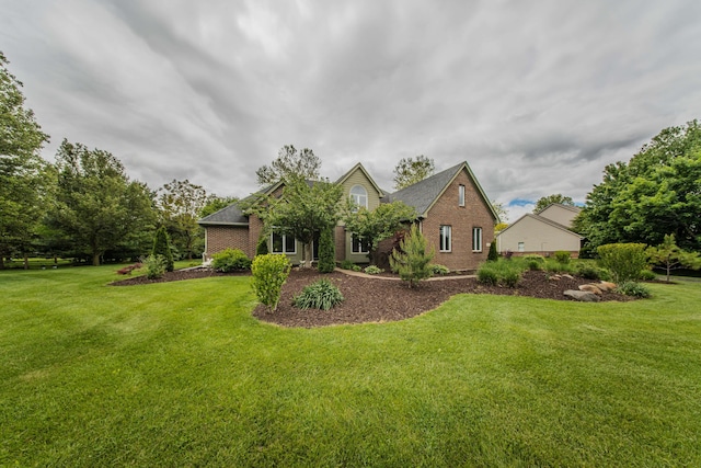 9117 Cambridge Dr, Saline, MI 48176 - view of front of home featuring brick siding and a front lawn