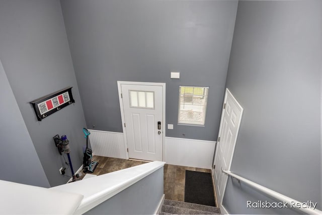 184 Dana Ln, Sand Lake, MI 49343 - foyer with a wainscoted wall, a towering ceiling, and wood finished floors