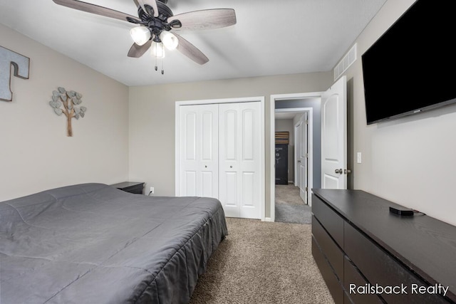 184 Dana Ln, Sand Lake, MI 49343 - bedroom featuring light colored carpet, a closet, and ceiling fan