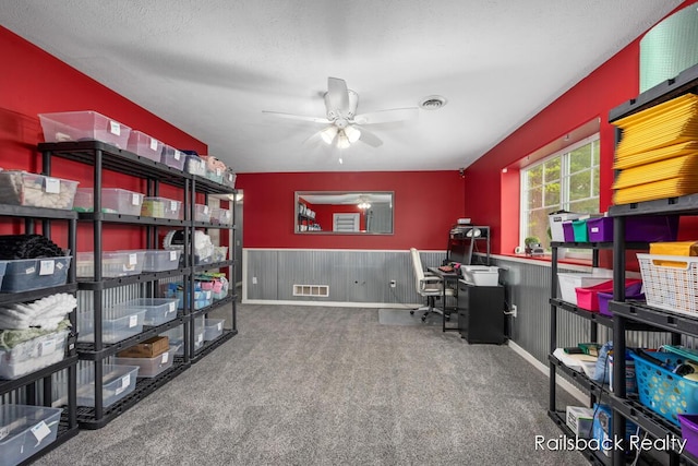 184 Dana Ln, Sand Lake, MI 49343 - office space with a ceiling fan, carpet, and a wainscoted wall