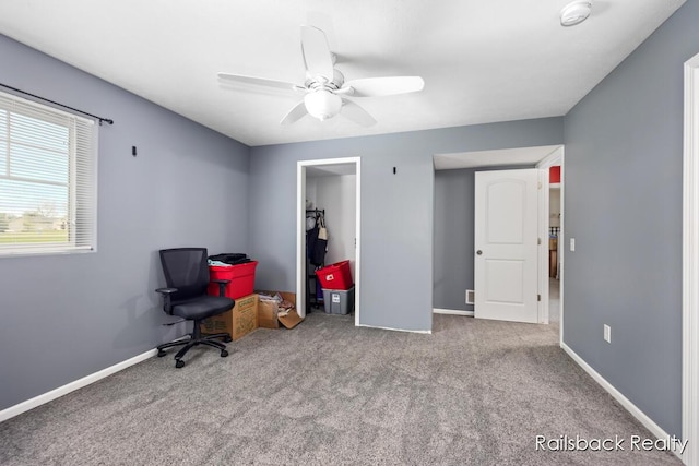 184 Dana Ln, Sand Lake, MI 49343 - carpeted home office with ceiling fan and baseboards