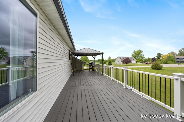 184 Dana Ln, Sand Lake, MI 49343 - wooden terrace featuring a gazebo and a yard