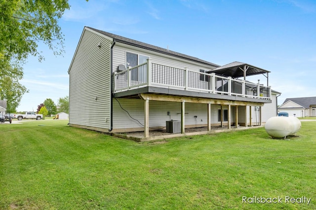 184 Dana Ln, Sand Lake, MI 49343 - back of house with a wooden deck, a lawn, and central AC