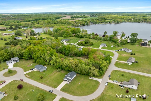 184 Dana Ln, Sand Lake, MI 49343 - aerial overview of property's location featuring a nearby body of water and a heavily wooded area