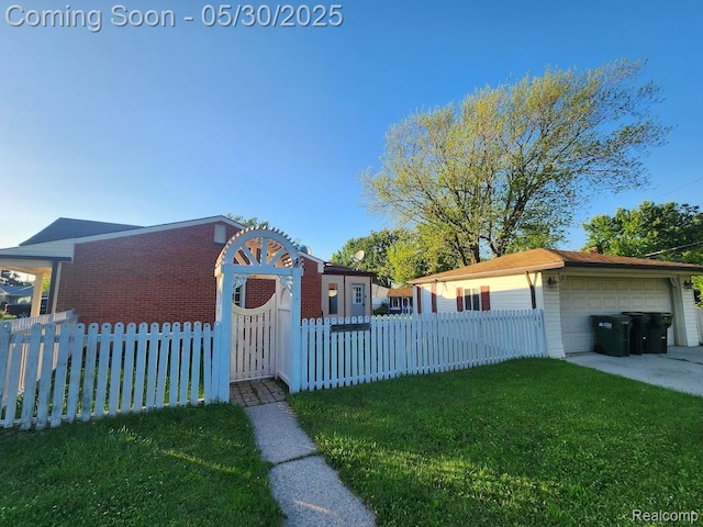 2625 Winston Dr, Sterling Heights, MI 48310 - view of front facade featuring a garage, brick siding, and a gate