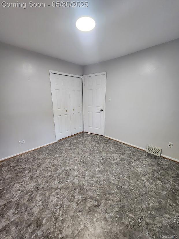 2625 Winston Dr, Sterling Heights, MI 48310 - unfurnished bedroom with a closet and baseboards