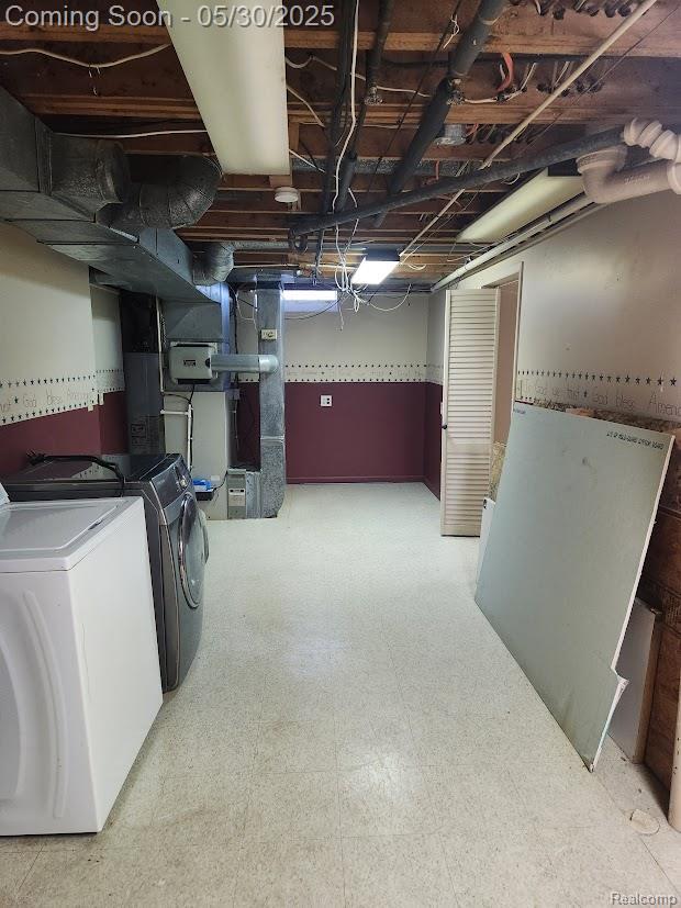 2625 Winston Dr, Sterling Heights, MI 48310 - unfinished below grade area with washing machine and dryer and tile patterned floors