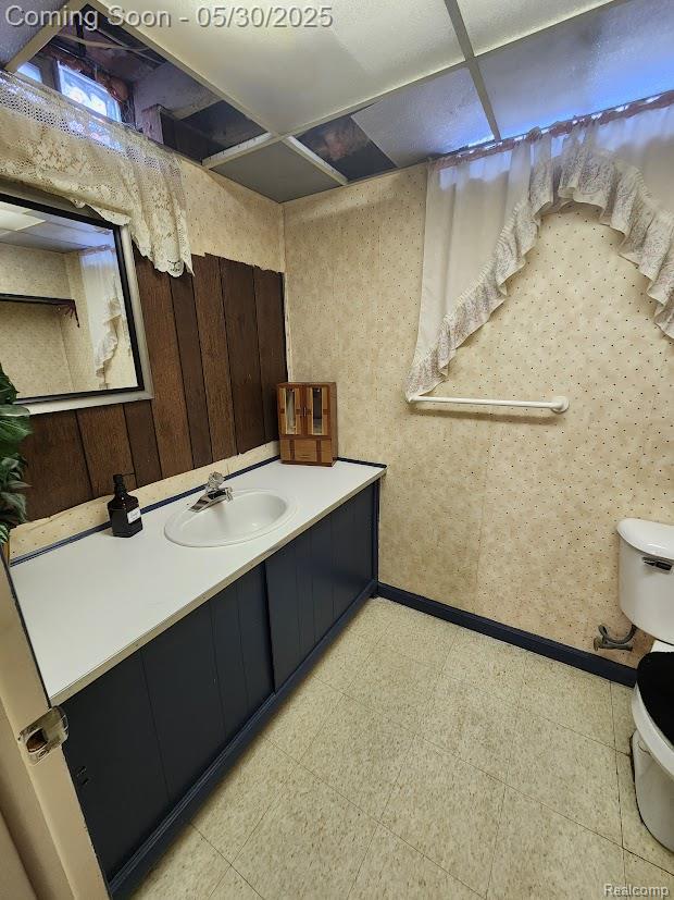 2625 Winston Dr, Sterling Heights, MI 48310 - bathroom with toilet, vanity, and tile patterned floors