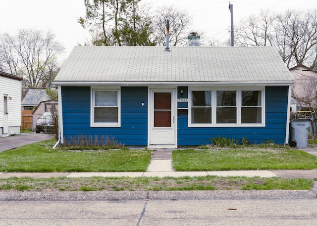 23067 Stauber Ave, Hazel Park, MI 48030 - view of front of home featuring a front lawn and a chimney