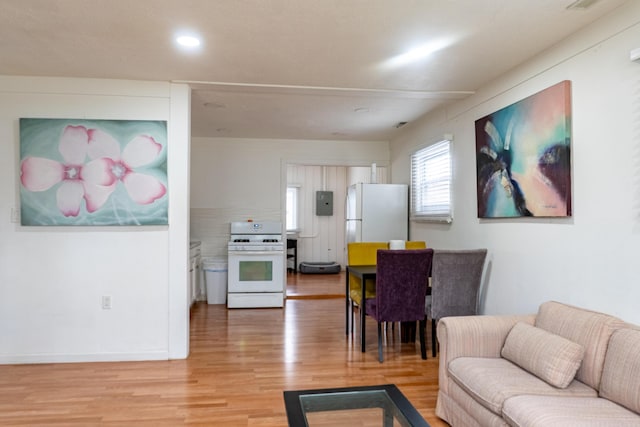 23067 Stauber Ave, Hazel Park, MI 48030 - living room with light wood finished floors, recessed lighting, electric panel, and baseboards