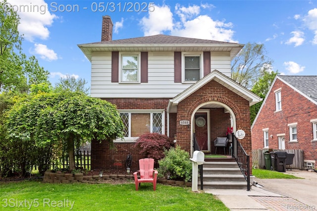 6568 Balfour Ave, Allen Park, MI 48101 - view of front of property featuring a chimney, brick siding, and a front lawn