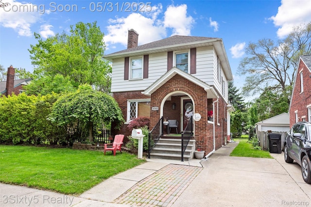 6568 Balfour Ave, Allen Park, MI 48101 - view of front of home featuring brick siding, a front lawn, and a chimney