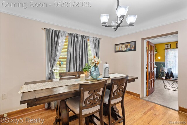 6568 Balfour Ave, Allen Park, MI 48101 - dining space with a chandelier, light wood-style floors, plenty of natural light, and baseboards