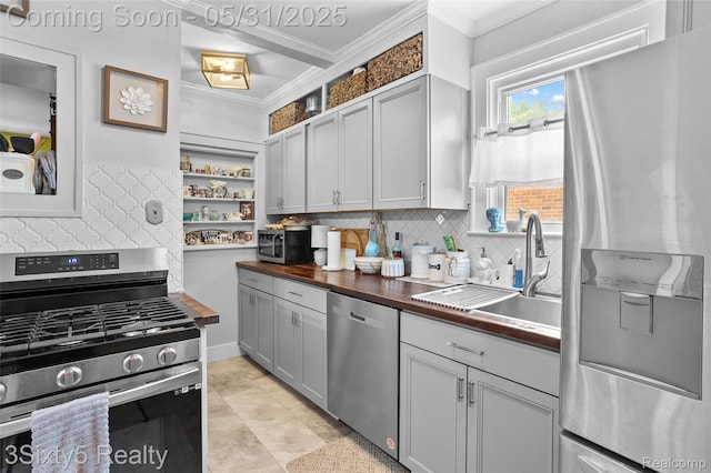 6568 Balfour Ave, Allen Park, MI 48101 - kitchen with stainless steel appliances, wooden counters, ornamental molding, open shelves, and tasteful backsplash