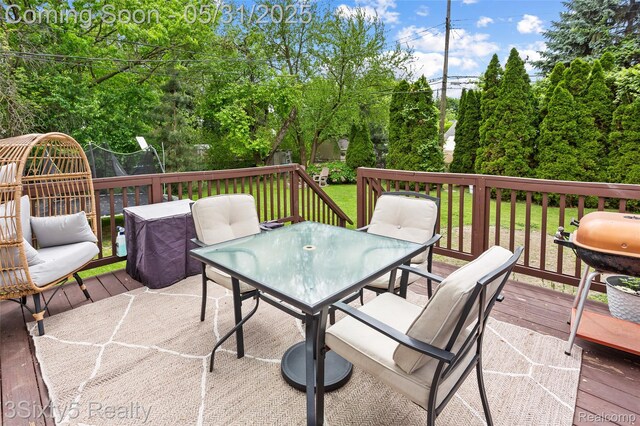6568 Balfour Ave, Allen Park, MI 48101 - deck featuring outdoor dining space, area for grilling, and a lawn