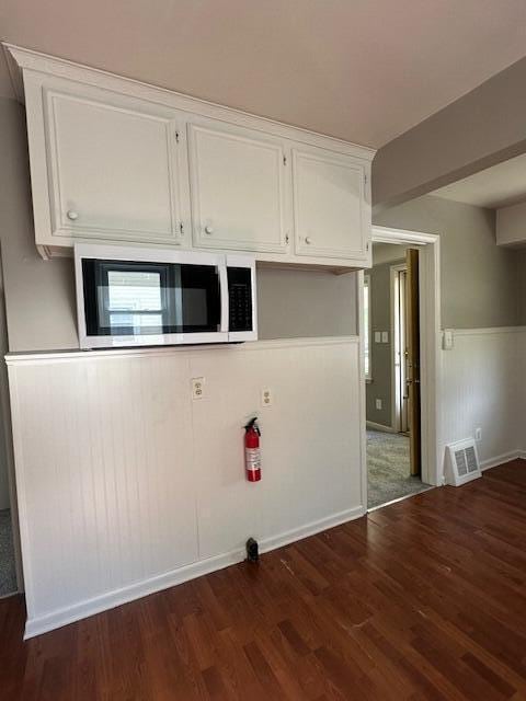 1858 Leblanc St, Lincoln Park, MI 48146 - washroom with wood finished floors and a wainscoted wall
