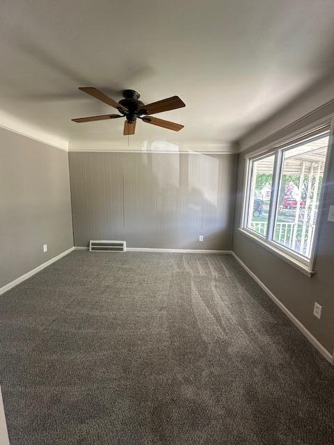 1858 Leblanc St, Lincoln Park, MI 48146 - carpeted empty room featuring ceiling fan and baseboards