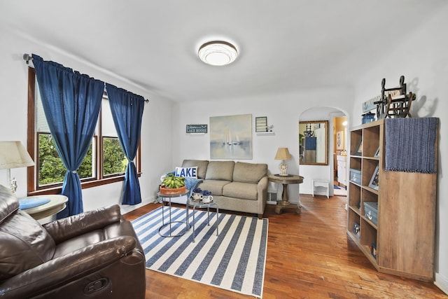 912 Gerald Ave, Jackson, MI 49203 - living area with arched walkways, wood finished floors, and baseboards