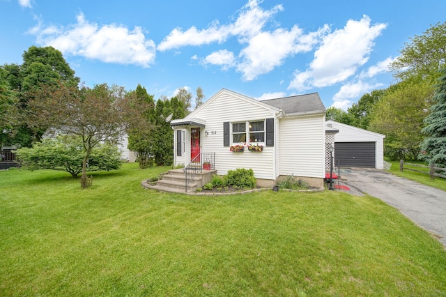 912 Gerald Ave, Jackson, MI 49203 - view of front of property featuring an outbuilding, a front lawn, and a garage