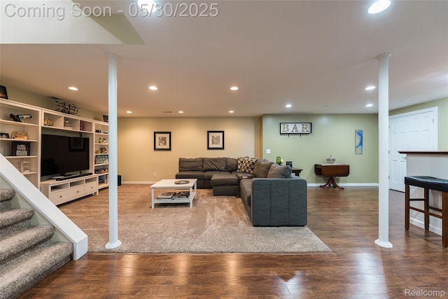 29811 Bradford Dr, New Hudson, MI 48165 - living area with recessed lighting, wood finished floors, baseboards, and decorative columns