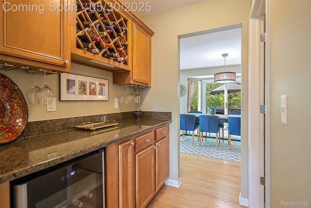 29811 Bradford Dr, New Hudson, MI 48165 - indoor bar with wine cooler and light wood finished floors