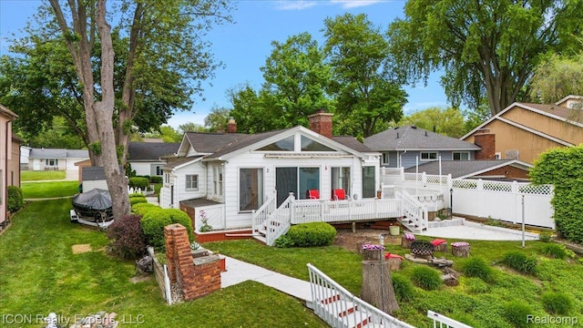 8569 Cooley Beach Dr, White Lake, MI 48386 - back of house featuring a patio, a wooden deck, a chimney, and stairway
