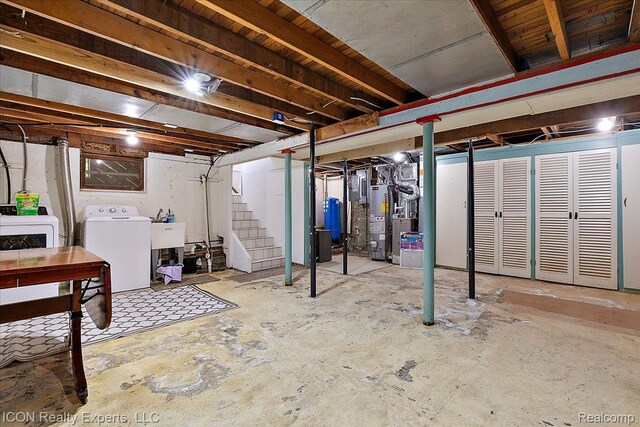 8569 Cooley Beach Dr, White Lake, MI 48386 - unfinished below grade area featuring water heater, a water pressure tank, stairs, independent washer and dryer, and electric panel