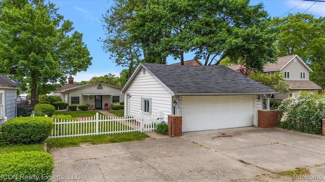 8569 Cooley Beach Dr, White Lake, MI 48386 - view of front facade with a fenced front yard