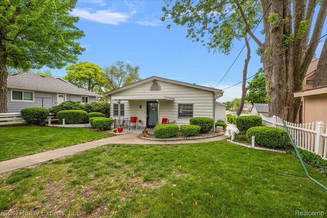 8569 Cooley Beach Dr, White Lake, MI 48386 - view of front of property with a porch