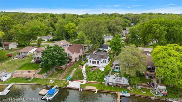 8569 Cooley Beach Dr, White Lake, MI 48386 - aerial perspective of suburban area featuring a nearby body of water and a heavily wooded area