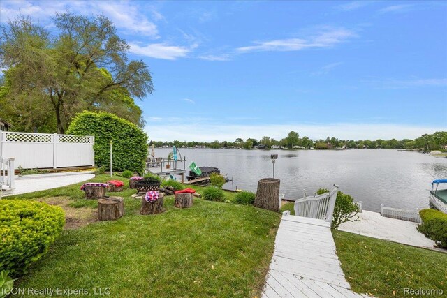 8569 Cooley Beach Dr, White Lake, MI 48386 - view of yard featuring a dock and a water view