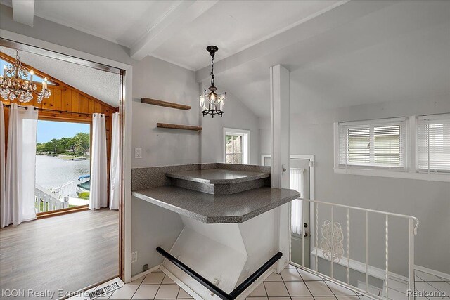 8569 Cooley Beach Dr, White Lake, MI 48386 - bathroom with a chandelier and tile patterned floors